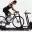 Cyclist using a Wahoo KICKR smart trainer indoors, connected to the Wahoo ecosystem