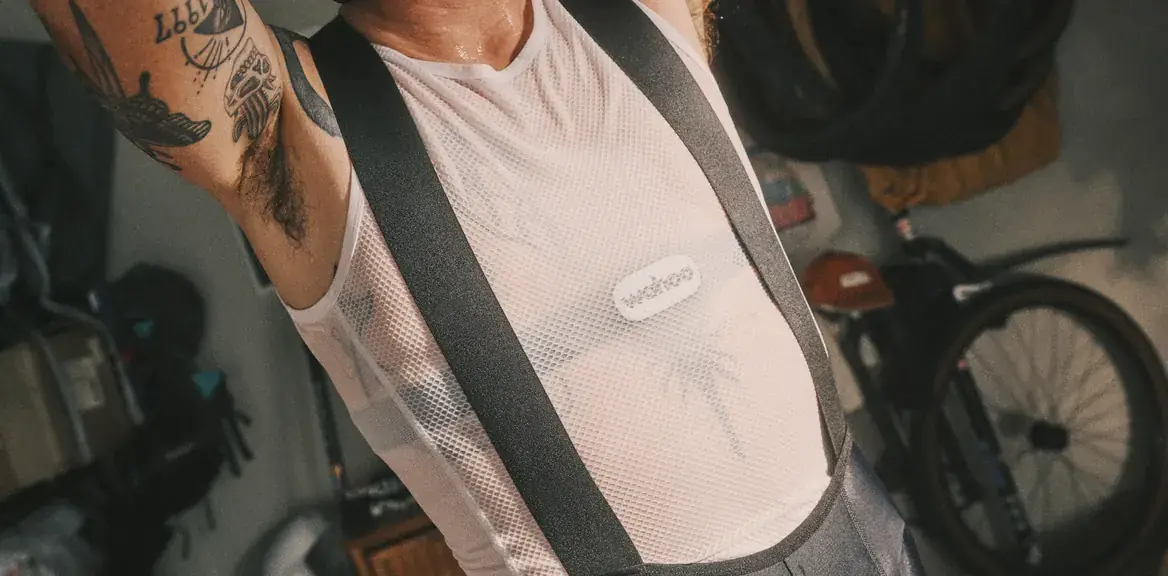 A rider wearing a Wahoo TRACKR heart rate monitor under a mesh base layer